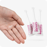 Image of three Conceive Plus try me size fertility lubricant applicators 3×4g and a hand with clear lube on its palm on a white a white background. Applicators are white with pink branding and text highlighting quantity of lube, manufacturer information, website url and storage directions.