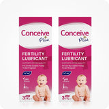 Image of two Conceive Plus try me size fertility lubricant applicators 3×4g boxes on a white background. Boxes are pink with white branding with highlights about sperm quality support, Ca+ and Mg+ content, pH balance, pre-filled feature, and quantity of applicators. Box feature a smiling baby on lower right corner.