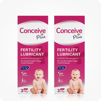 Image of two Conceive Plus try me size fertility lubricant applicators 3×4g boxes on a white background. Boxes are pink with white branding with highlights about sperm quality support, Ca+ and Mg+ content, pH balance, pre-filled feature, and quantity of applicators. Box feature a smiling baby on lower right corner.