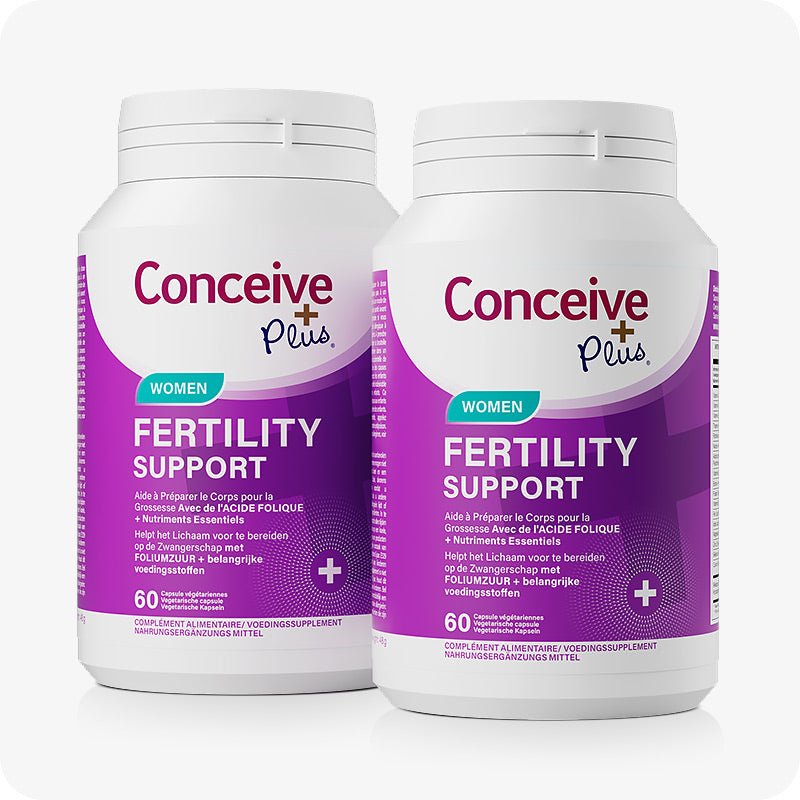 Conceive Plus Women's Fertility Support (FR) twin-pack featuring two 60-capsule bottles with bilingual French and Dutch labels, vibrant purple and white design, and folic acid highlight—ideal for extended fertility care with essential nutrients for reproductive health.