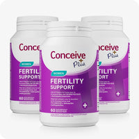 Conceive Plus Women's Fertility Support (FR) three-pack of 60-capsule bottles with purple and white labels, designed for female fertility care; features multilingual front labeling in French and Dutch with folic acid and essential nutrients prominently displayed.